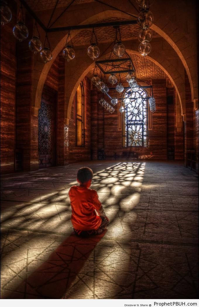 Boy Prays at Al-Fateh Grand Mosque in Manama, Bahrain - Al-Fateh Grand Mosque in Manama, Bahrain -Picture