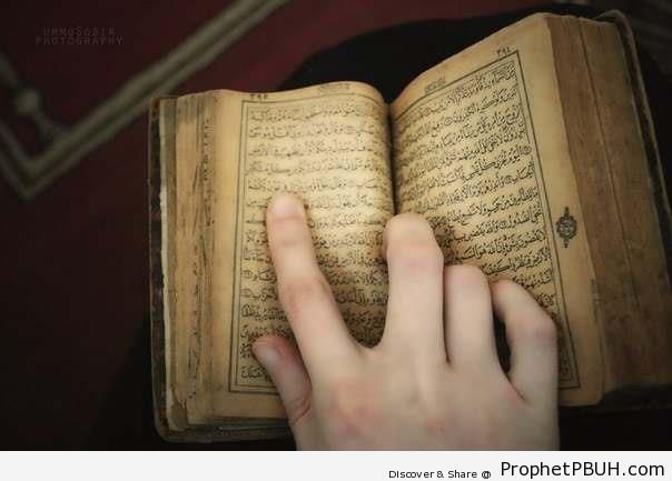 Hand on Old Mushaf - Mushaf Photos (Books of Quran)