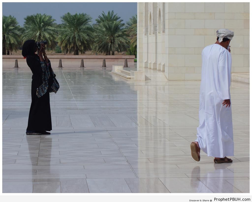 Hijabi Woman Taking Photos at Sultan Qaboos Grand Mosque in Muscat, Oman - Islamic Architecture -Picture
