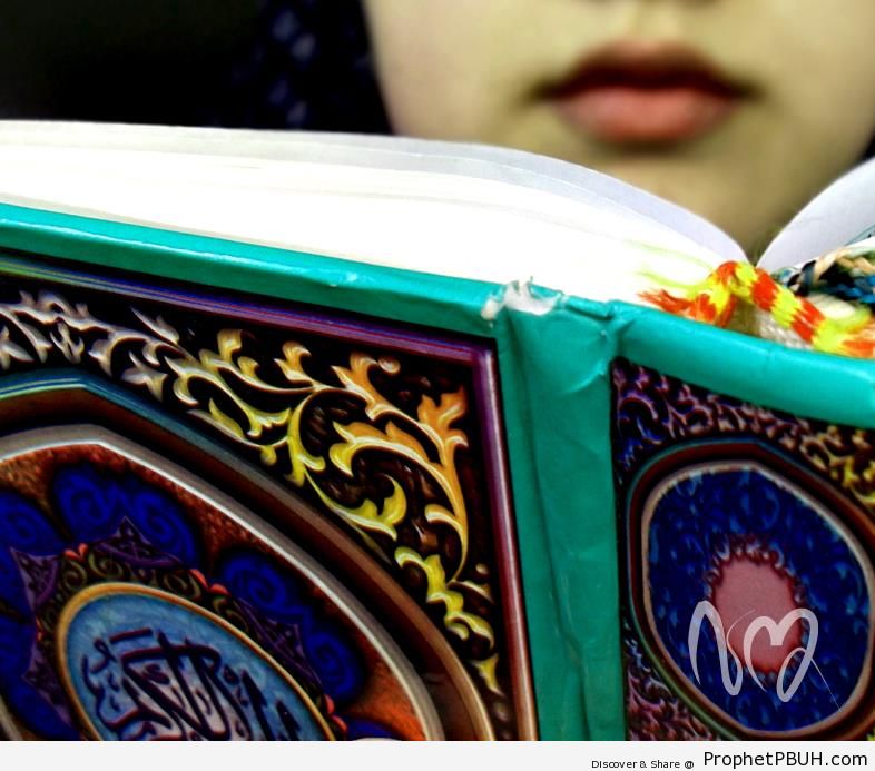 Lips Visible Over Open Quran (Photo of Girl Reading Quran) - Mushaf Photos (Books of Quran) 