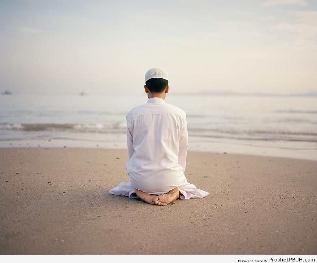 Man Praying Toward The Ocean - Photos -