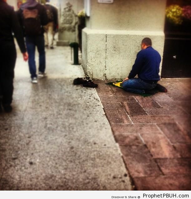 Man Praying by the Street - Photos