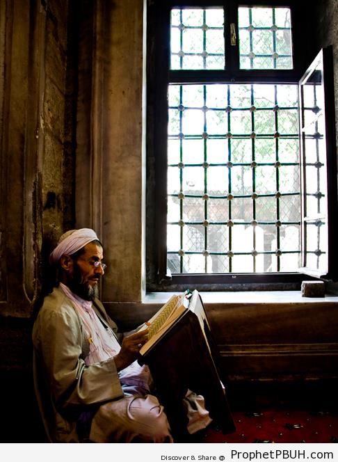 Man Reading the Quran by Window - Photos of Male Muslims