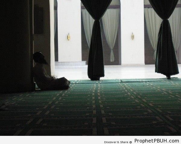Man Sitting in Mosque Prayer Hall - Islamic Architecture