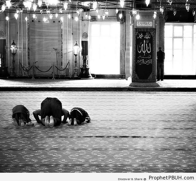 Man and Boys Praying at Mosque - Photos