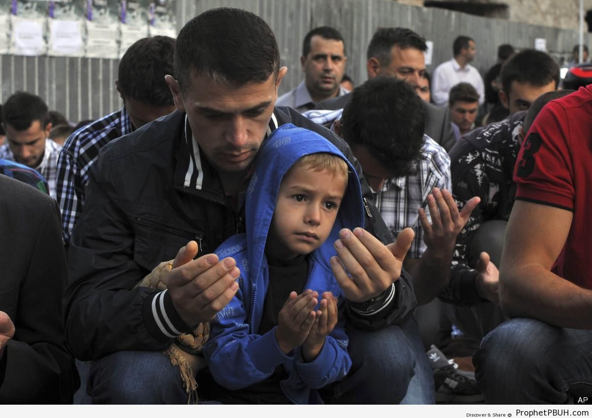 Muslim Boy Prays with His Father at the Kosovo Grand Mosque in Pristina, Kosovo on Eid al-Fitr 2012 - Kosovo -Picture