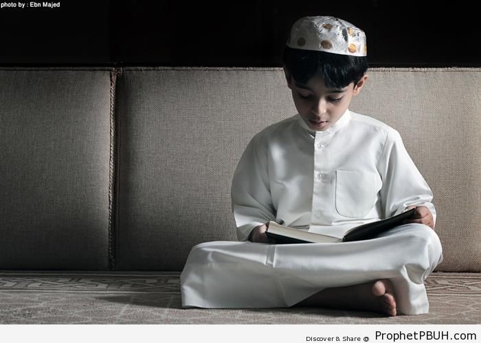 Muslim Boy Reading the Quran - Mushaf Photos (Books of Quran) 