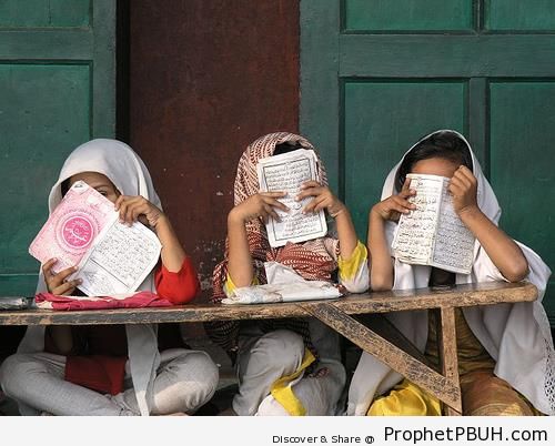 Muslim Little Girls Covering Their Faces With Books of Quran - Muslimah Photos (Girls and Women & Hijab Photos)