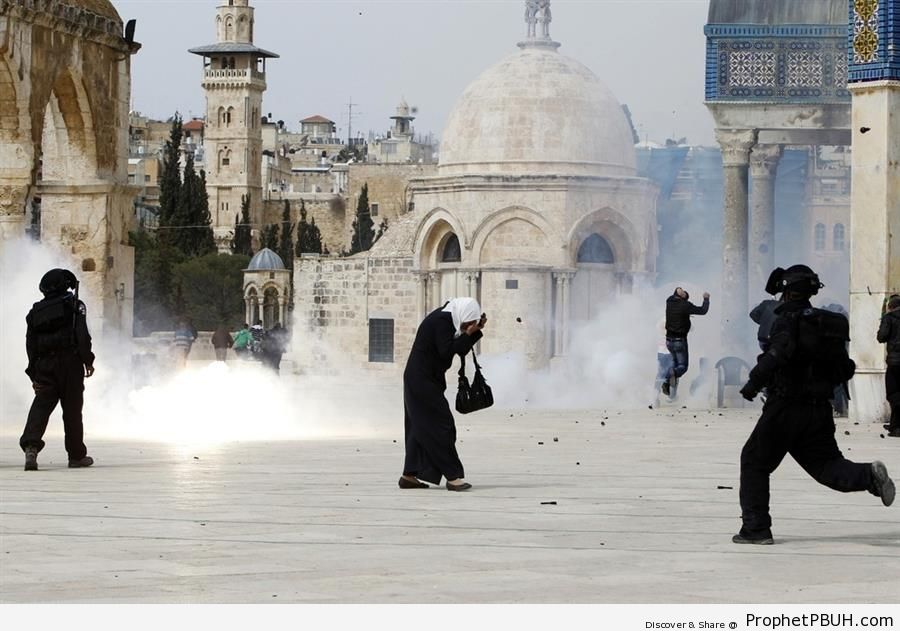Palestinian Woman Covers Her Face at Israeli Stun Grenade Explosion (Jerusalem) - Al-Quds (Jerusalem), Palestine 