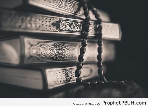 Photo of a Stack of Mushafs with Prayer Beads - Islamic Black and White Photos