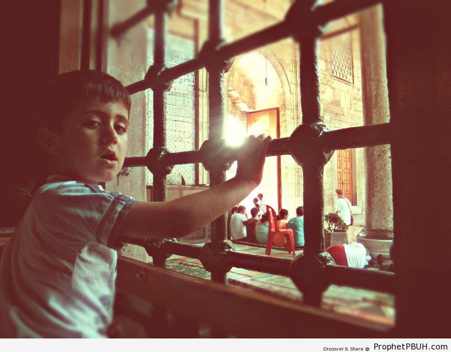 Boy at Mosque Window - Islamic Architecture -Picture