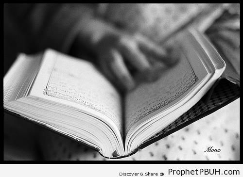 Hand Between Pages of Quran - Islamic Black and White Photos