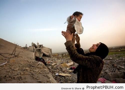 Happy Palestinian Mother and Child by Their Destroyed Home - Muslimah Photos (Girls and Women & Hijab Photos)