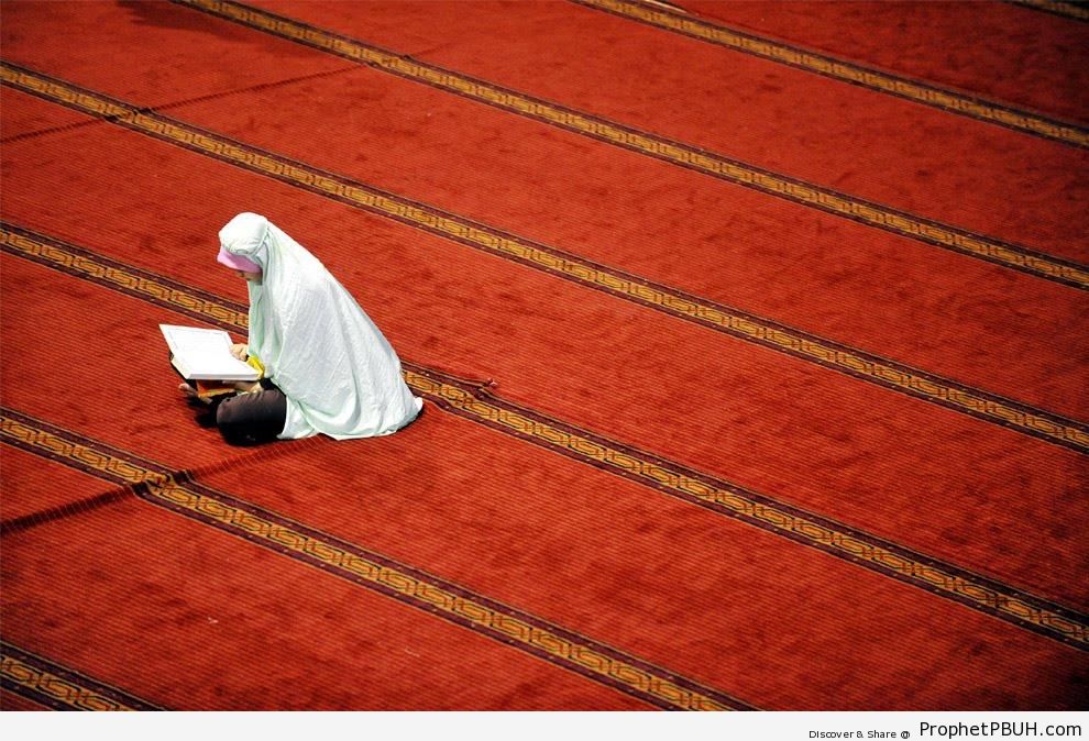 Indonesian Muslim Woman Reading the Quran in Jakarta, Indonesia - Indonesia 