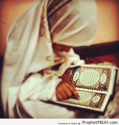 Little Girl in Hijab Reading the Quran - Mushaf Photos (Books of Quran)