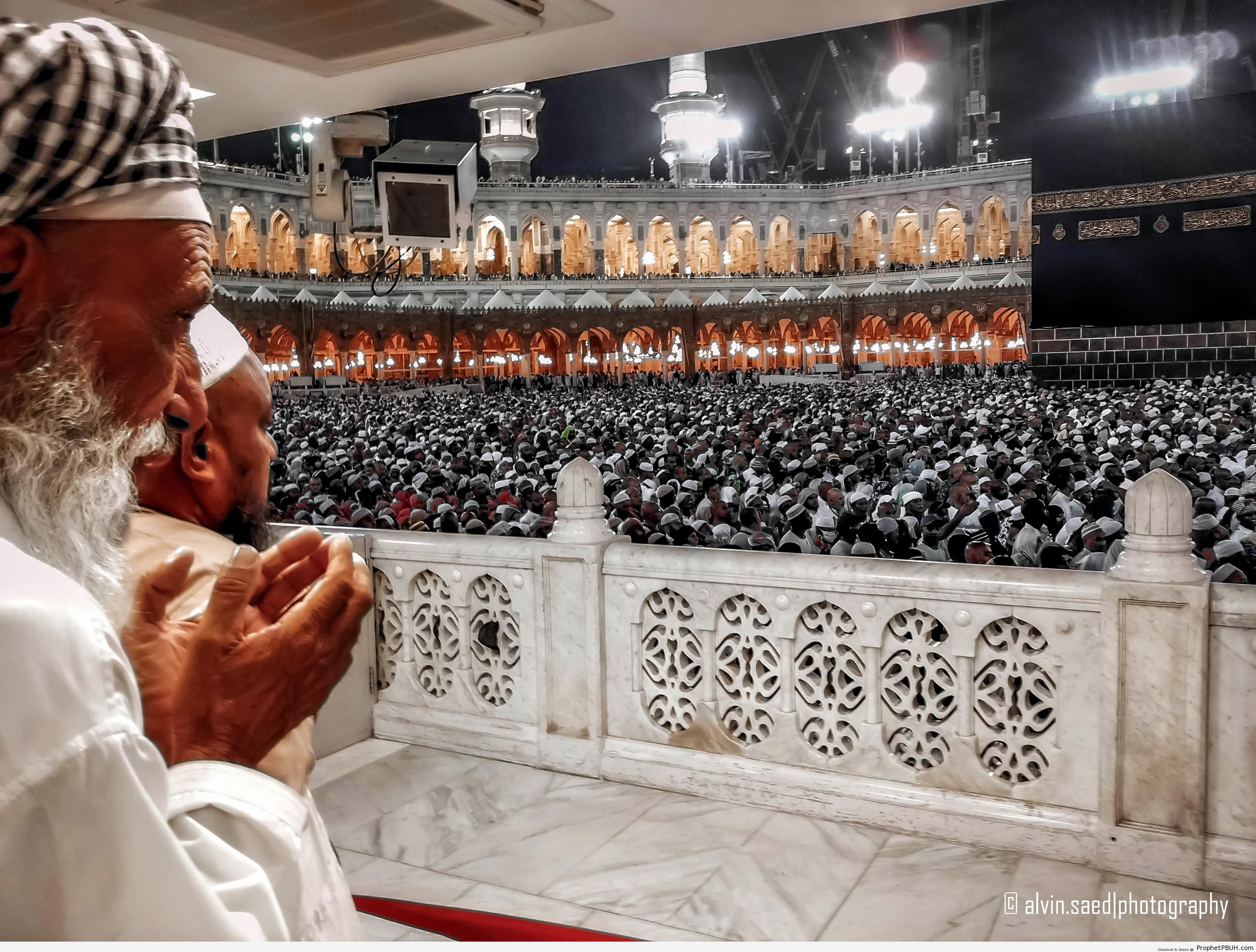 Man Making Dua at Masjid alHaram [Nighttime Photo] alMasjid al
