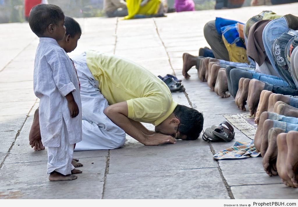Men Praying in New Delhi, India - New Delhi, India 