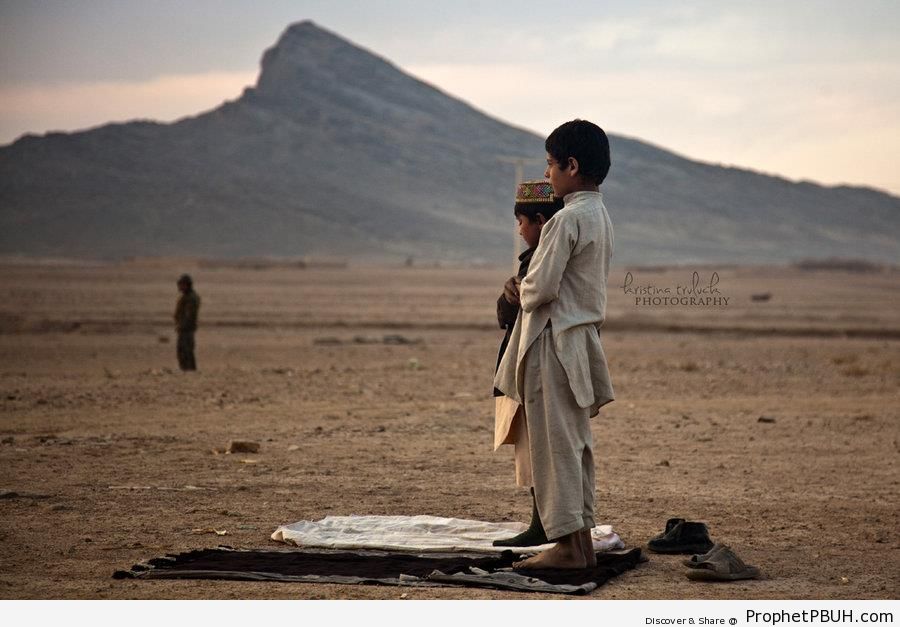 Muslim Boys Praying Outdoors by Mountain - Photos -
