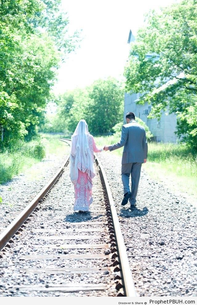 Muslim Couple Walking By Railroad Track - Muslimah Photos (Girls and Women & Hijab Photos)