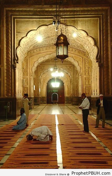 Muslim Men Praying Inside Badshahi Mosque in Lahore, Punjab - Badshahi Masjid in Lahore, Pakistan