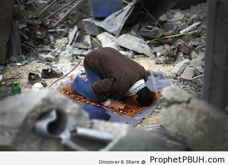 Palestinian Man Prays in Destroyed House - Photos