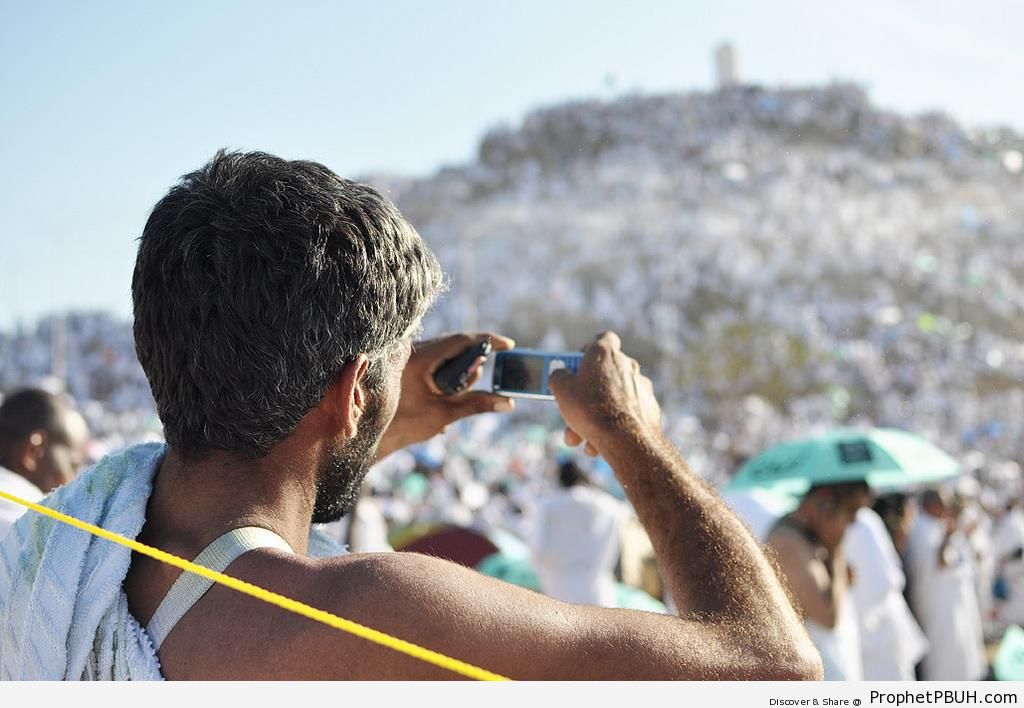 Pilgrim Taking Photo at Mount Arafat - Photos of Haj Proceedings
