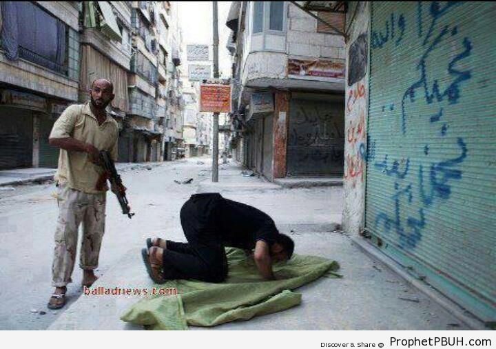 Syrian Rebel Protecting Praying Brother - Photos -